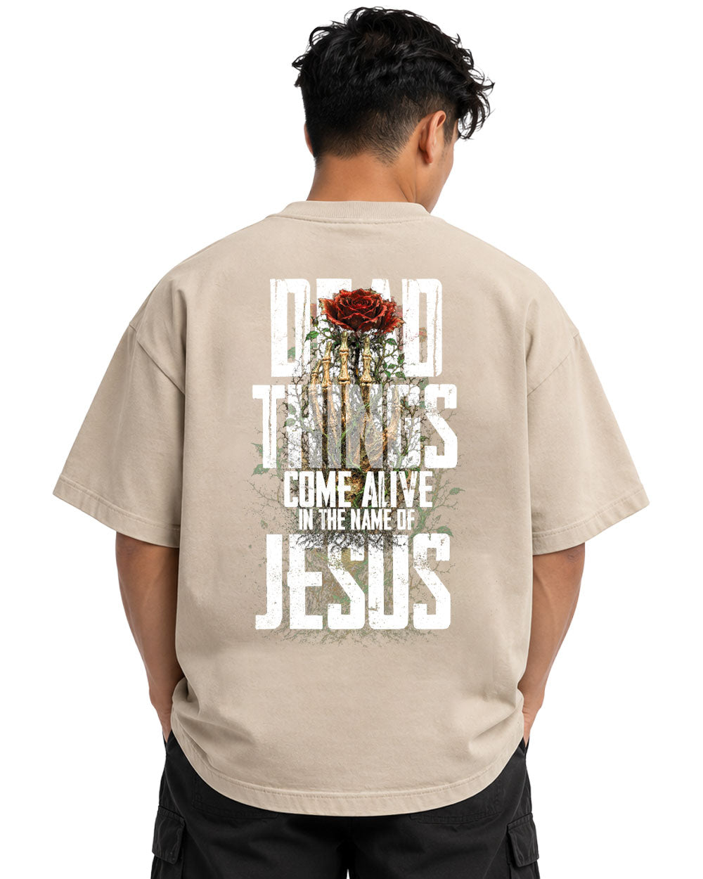 Model wearing the Dead Things Come Alive Oversized Tee in sand, oversized Christian t-shirt by Calvary Design Prints