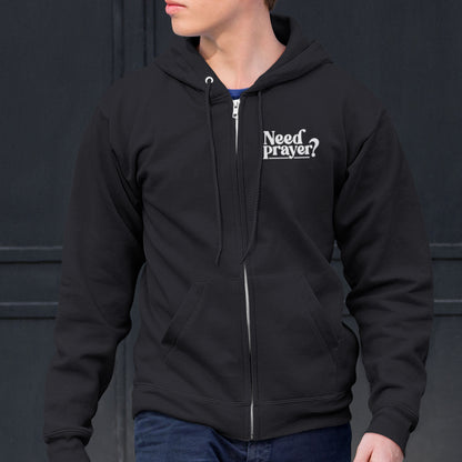 Black zip-up Christian hoodie with “Need Prayer?” chest print, unisex oversized fit
