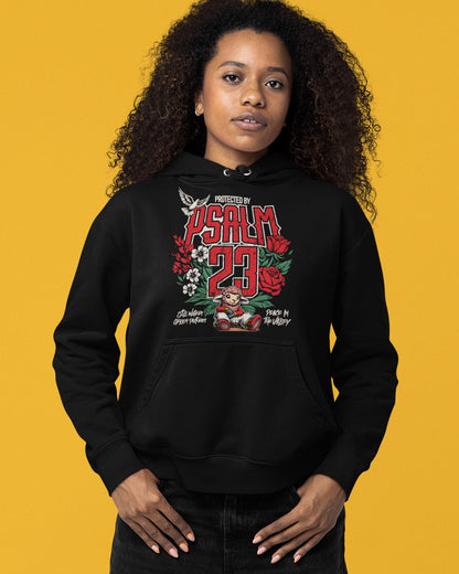 Person wearing a black hoodie with 'Psalm 23' design on a yellow background